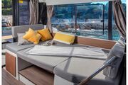 Jeanneau Merry Fisher 1095 - table in wheelhouse converts to berth Jeanneau Merry Fisher 1095