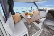 Jeanneau Merry Fisher 795 Series 2 - port side saloon table sand seating + reversible co-pilot seat Jeanneau Merry Fisher 795 - Series 2